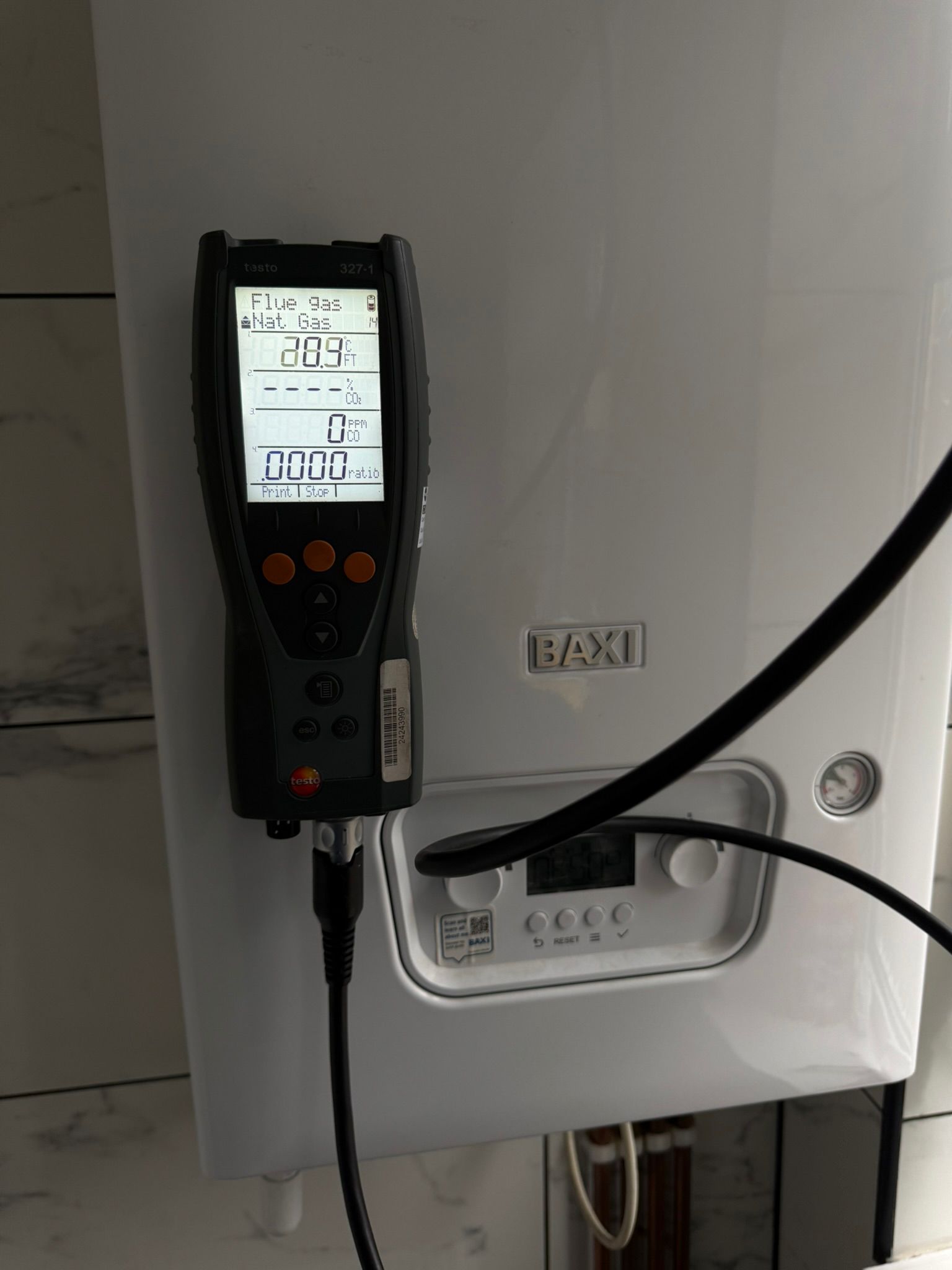 Flue gas analyser reading on a Baxi boiler during a gas safety check